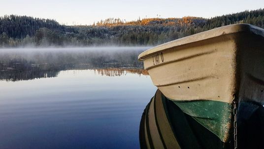 Row boat on lake
